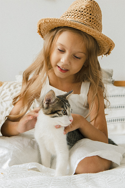 photo of a girl with a cat